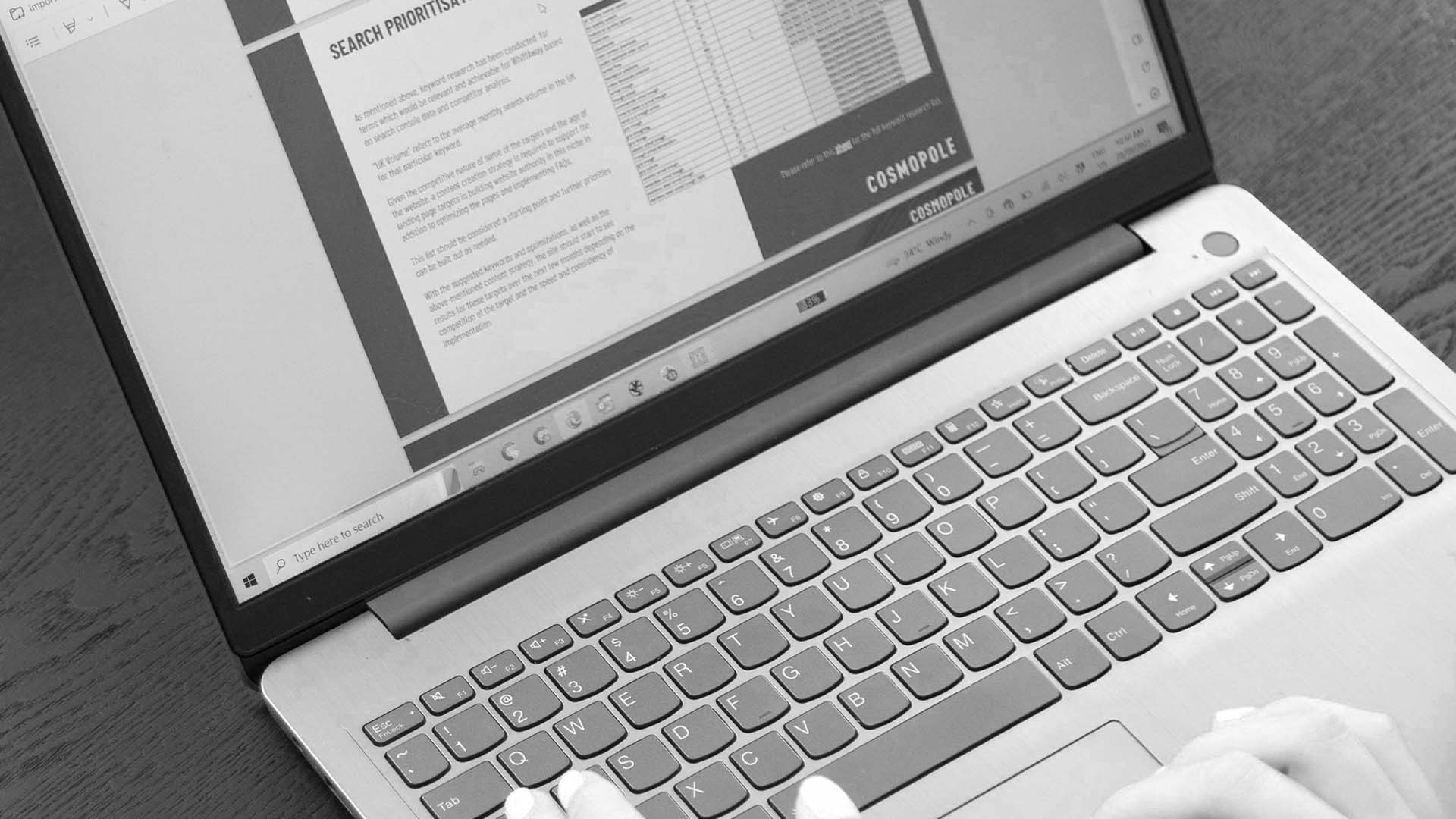 a laptop with Cosmopole PowerPoint template