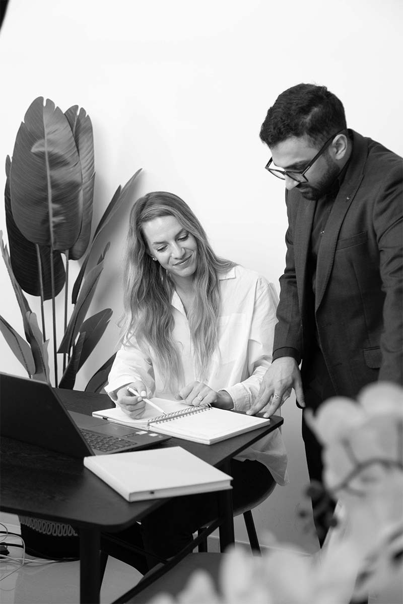 A collaborative workspace highlighting teamwork and strategy as a professional discusses plans.